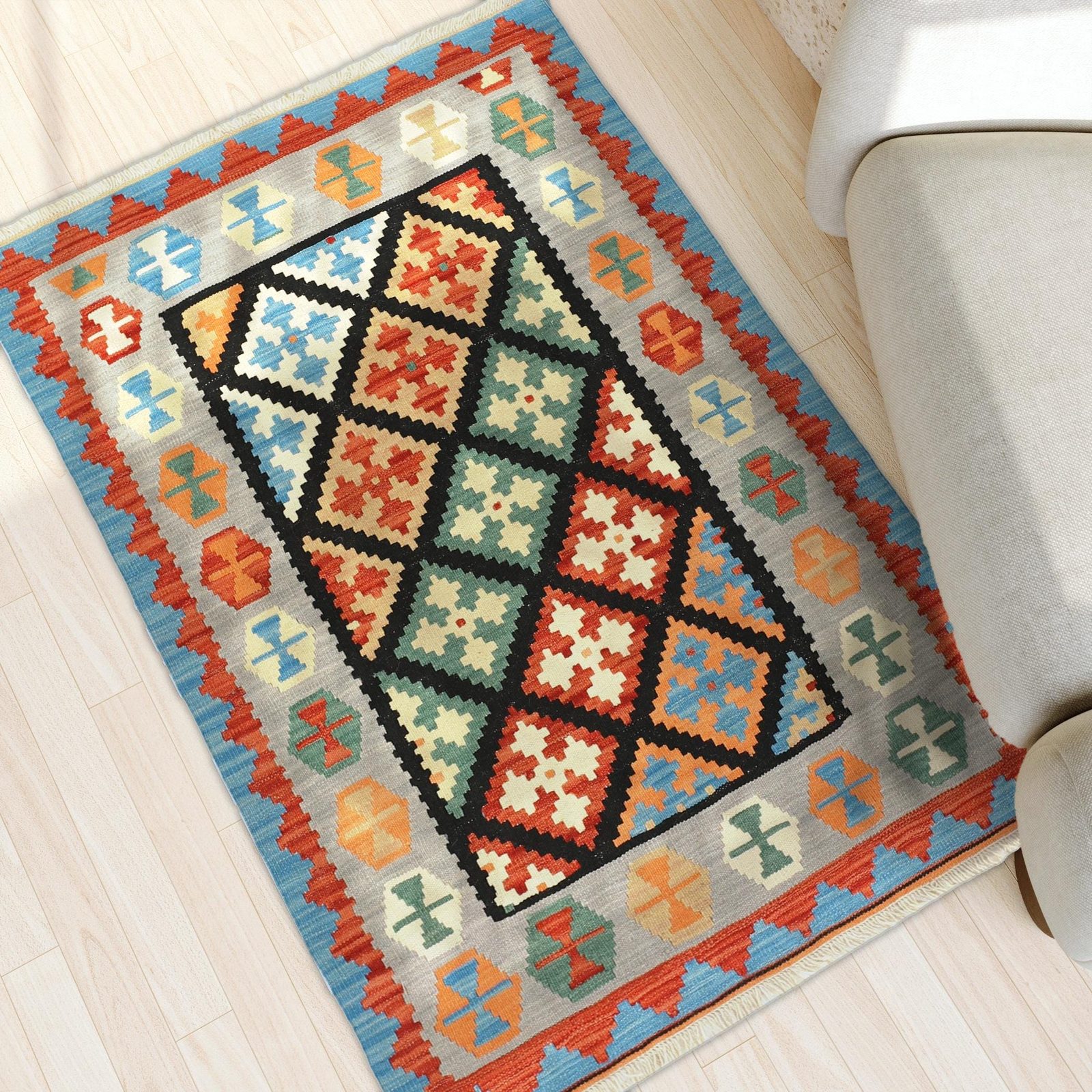 Kilim Rug in Black and Green in a light living room, true size