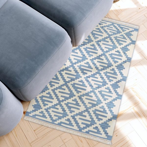 Small Kilim Rug in Blue and Cream in a light living room, true size