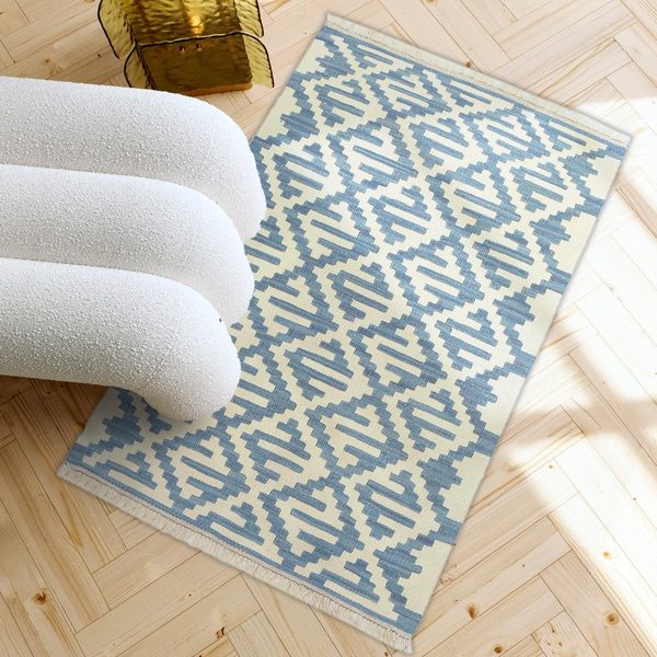 Small Kilim Rug in Blue and Cream in a light living room, true size